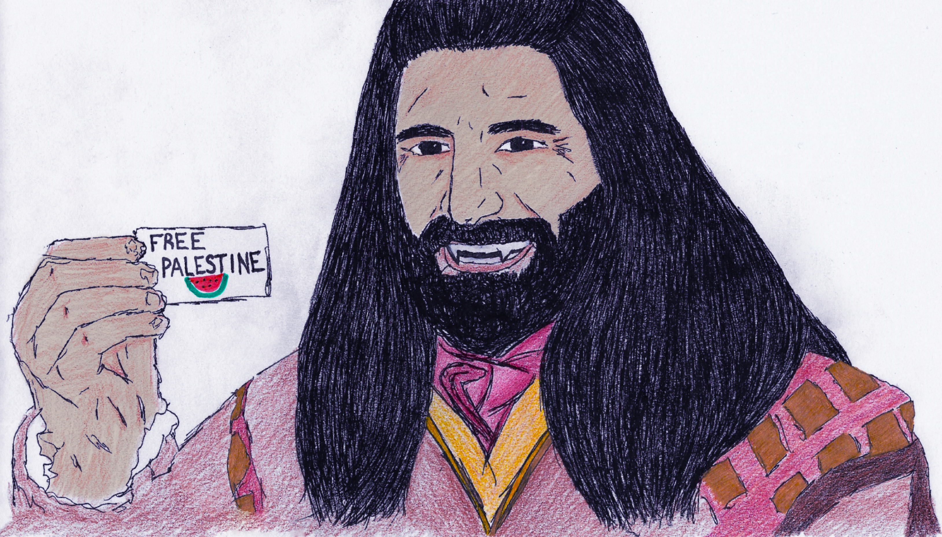 Nandor holding a small card that says Free Palestine.